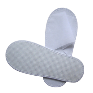 Disposable non-woven slipper with EVA shoe sole